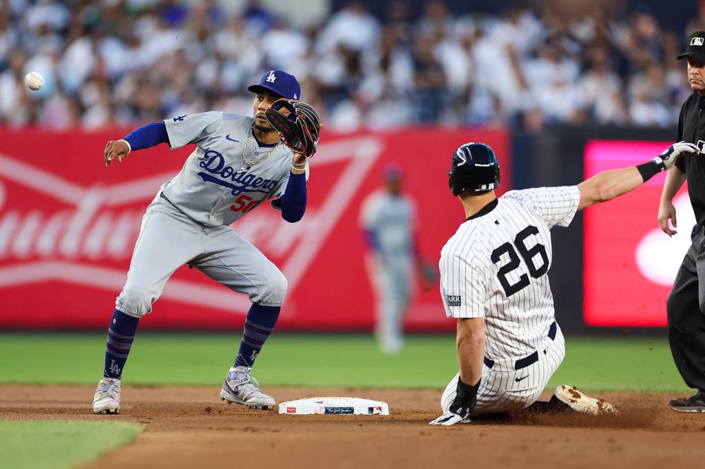 Mookie Betts #50 of the Los Angeles Dodgers tags out DJ LeMahieu #26 of the New York Yankees at second base during the fourth inning at Yankee Stadium on June 09, 2024 in the Bronx borough of New York City. 