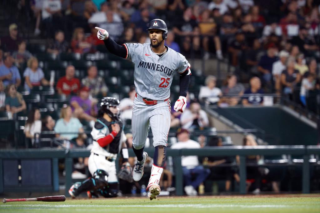 Byron Buxton #25 of the Minnesota Twins gestures to the Twins benchafter hitting a three run home run during the fourth inning against the Arizona Diamondbacks at Chase Field on June 27, 2024 in Phoenix, Arizona.
