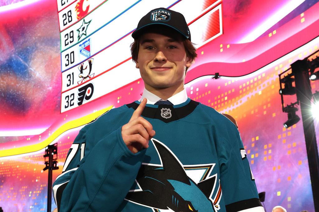 Macklin Celebrini holds up a finger signifying number one after being selected first overall by the San Jose Sharks during the first round of the 2024 Upper Deck NHL Draft at Sphere on June 28, 2024 in Las Vegas, Nevada. 