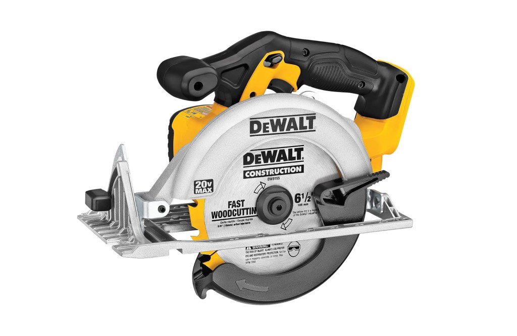 A circular saw with a black handle