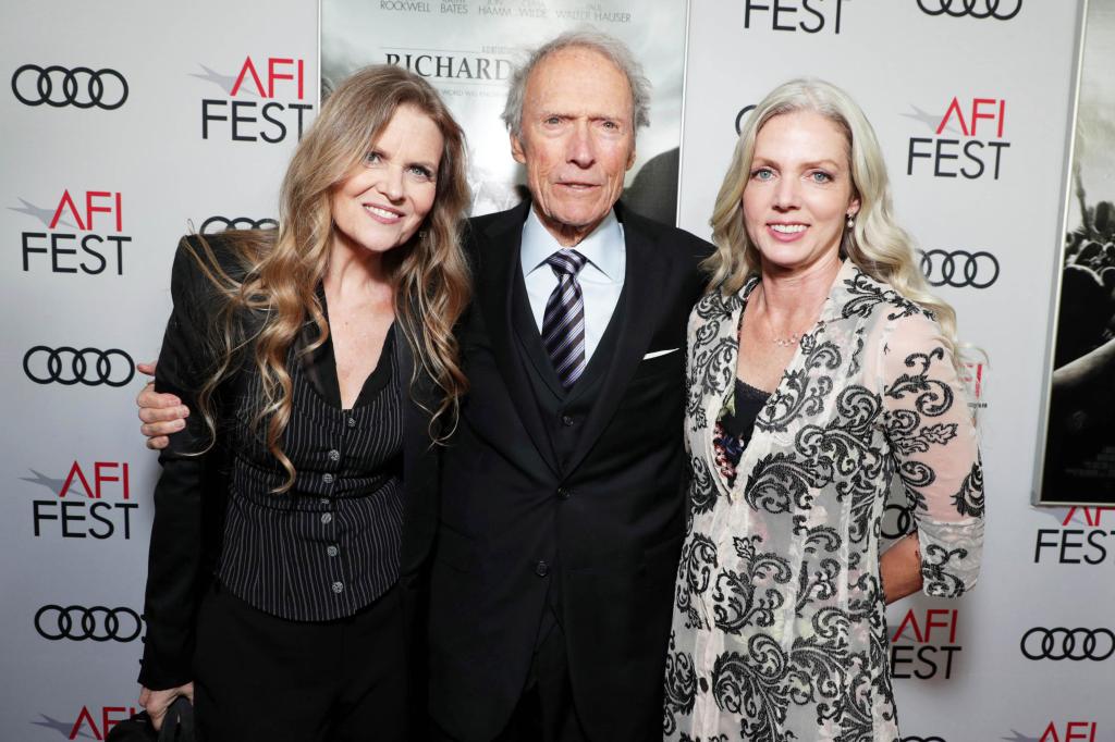 Clint Eastwood poses with girlfriend Christina Sandera on the red carpet at AFI Fest in 2019. 