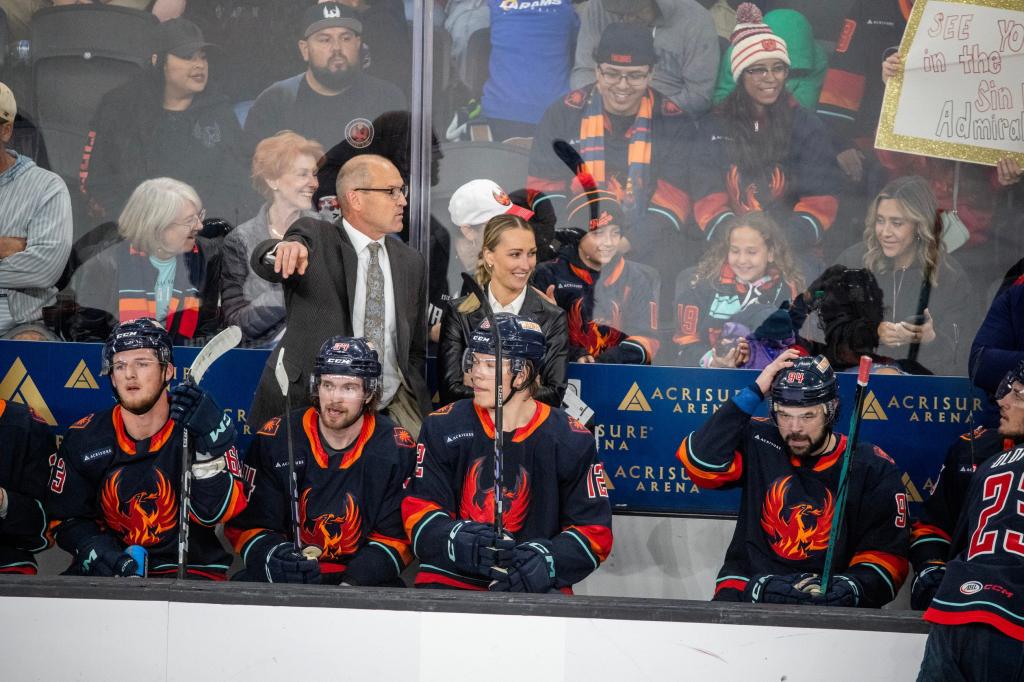 Coachella Valley Firebirds head coach Dan Bylsma and assistant coach Jessica Campbell behind the bench during a playoff game on May 29, 2024.