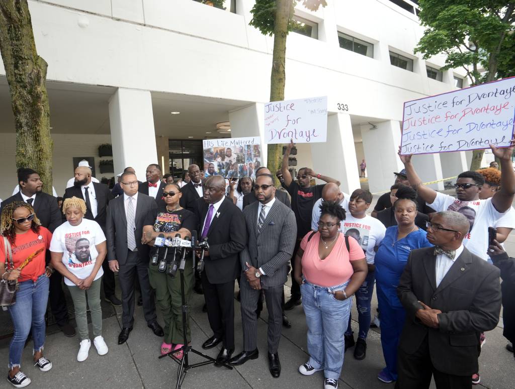 His family are demanding criminal charges be filed after reviewing hotel surveillance video Wednesday that they allege showed the guards chasing Mitchell inside the hotel and then dragging him outside.