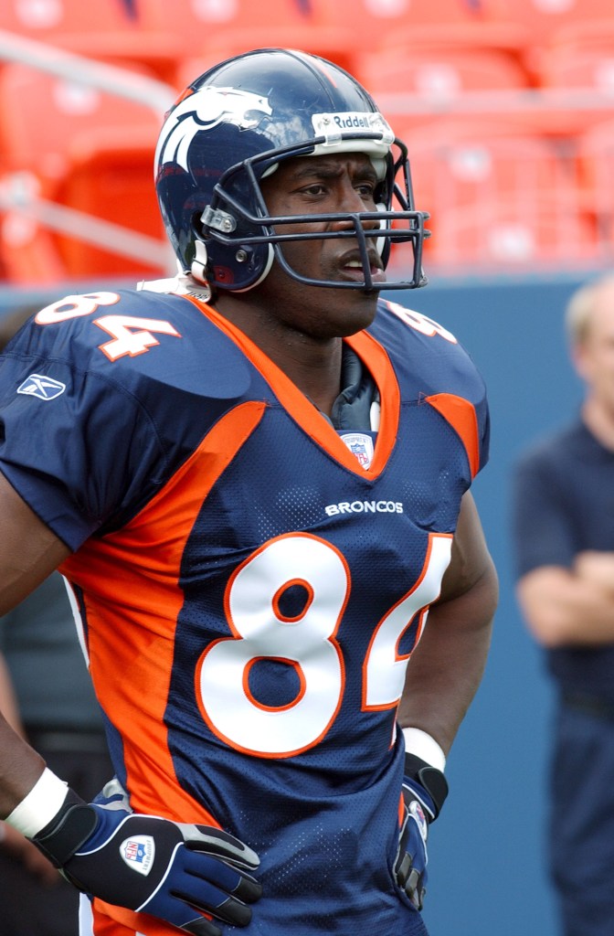 Denver Broncos receiver Shannon Sharpe in blue uniform, concentrating before a game against the Indianapolis Colts at Invesco Field, Denver, August 25, 2003