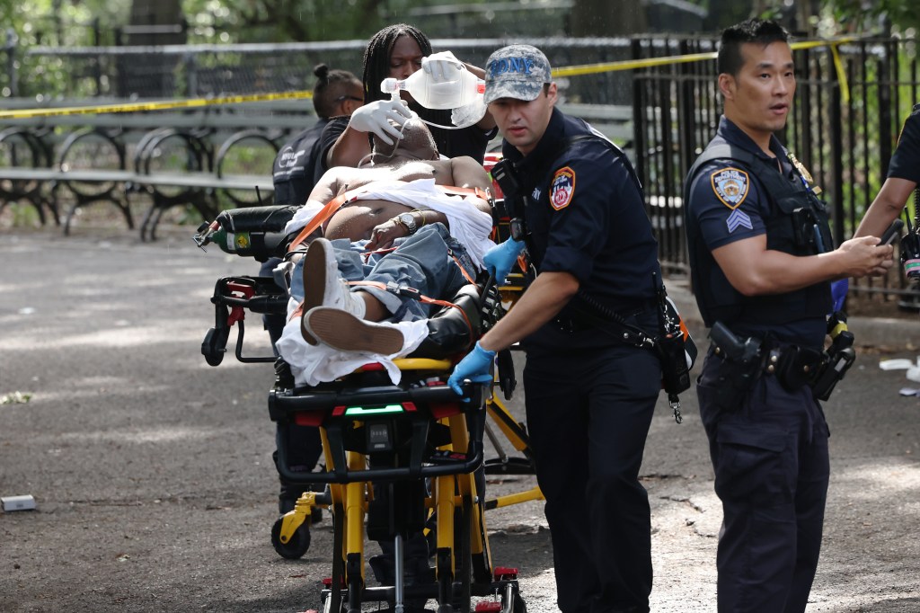 EMS transporting 1 of 2 shooting victims with a chest wound from Tompkins Square Park 