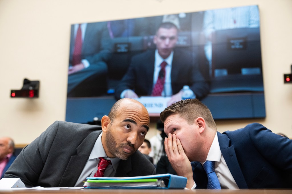 FBI whistleblower Marcus Allen, left, and Tristan Leavitt, president, Empower Oversight, confer during the House Judiciary Select Subcommittee on the Weaponization of the Federal Government to "examine abuses seen at the Bureau and how the FBI has retaliated against whistleblowers," in Rayburn Building on Thursday, May 18, 2023. 