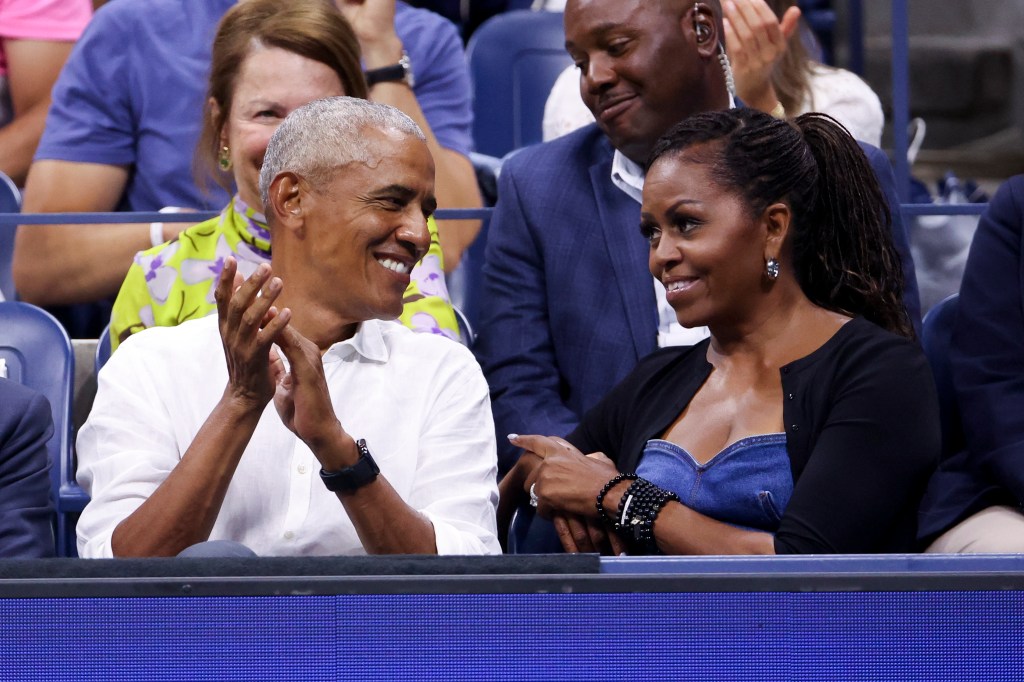 Former President Barack Obama and Michelle Obama watching a men's singles first round match at the 2023 US Open in Arthur Ashe Stadium