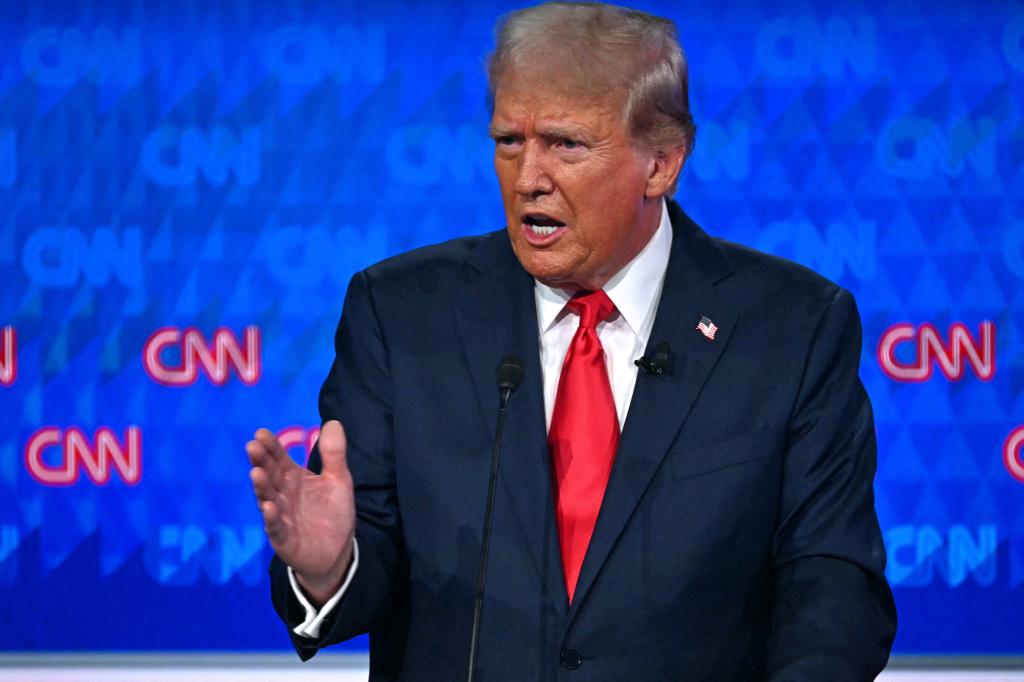 Donald Trump speaking behind a podium.