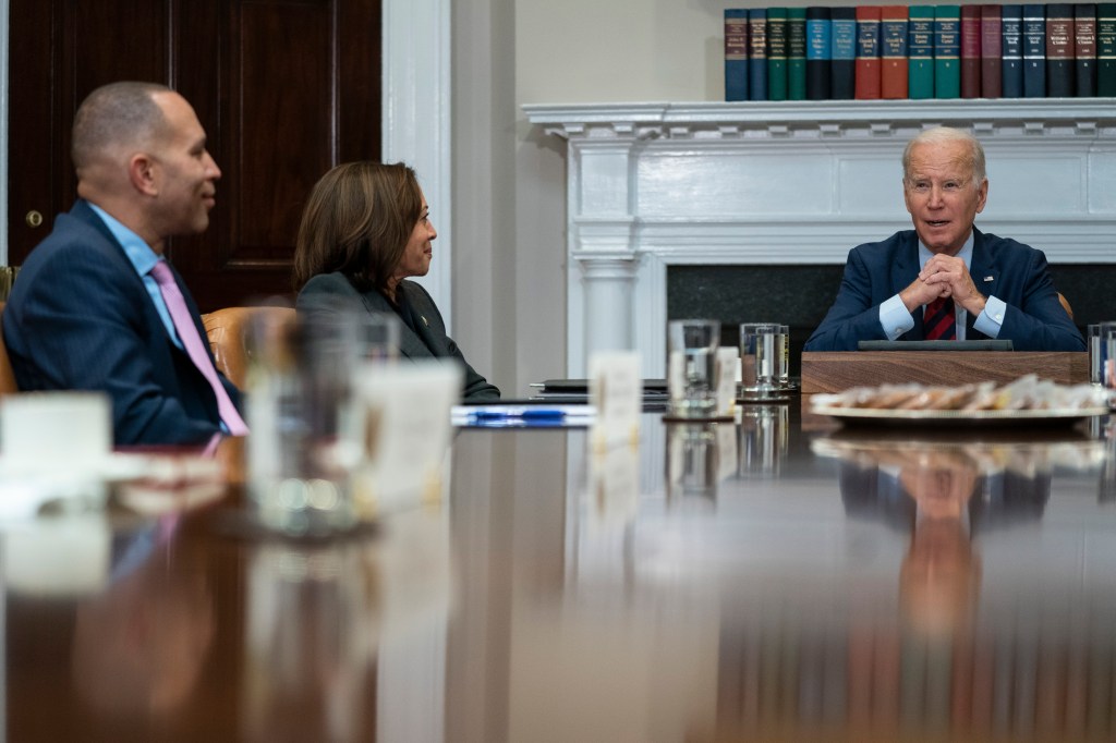 House Minority Leader Hakeem Jeffries of N.Y., left, and Vice President Kamala Harris listen as President Joe Biden speaks during a meeting with Democratic lawmakers in the Roosevelt Room of the White House, Jan. 24, 2023, in Washington. 