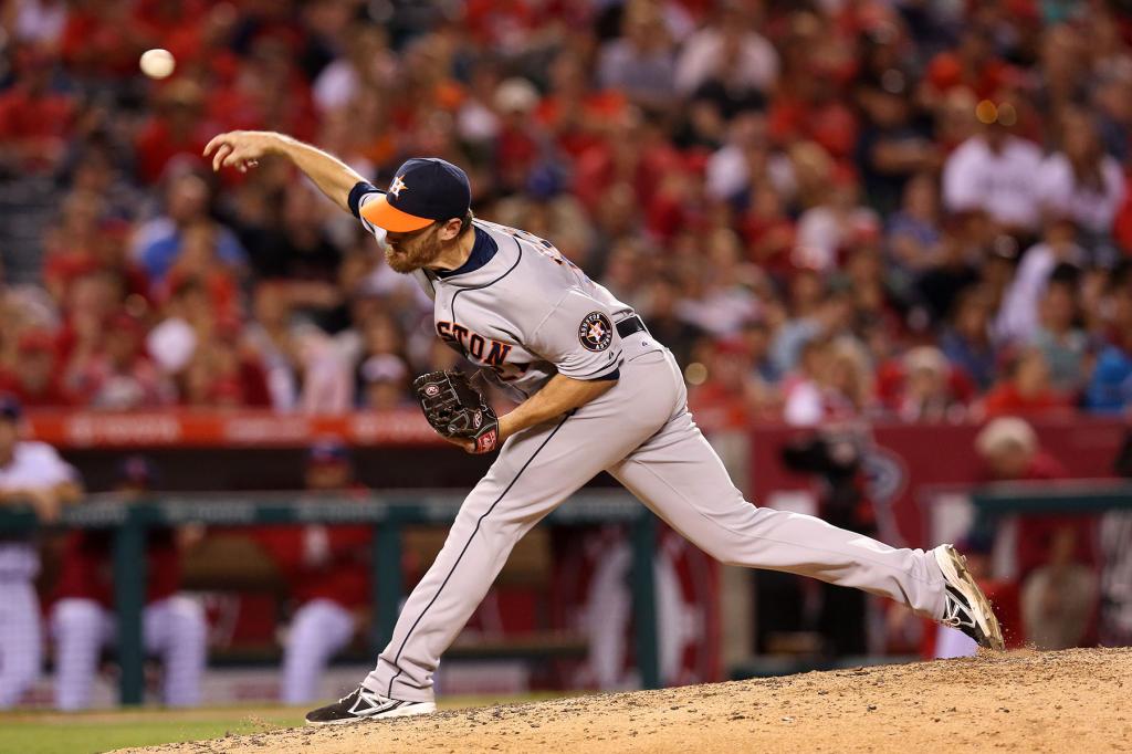 Reliever Philip Humber #21 of the Houston Astros throws a pitch against the Los Angeles Angels of Anaheim at Angel Stadium of Anaheim on August 17, 2013 in Anaheim, California.