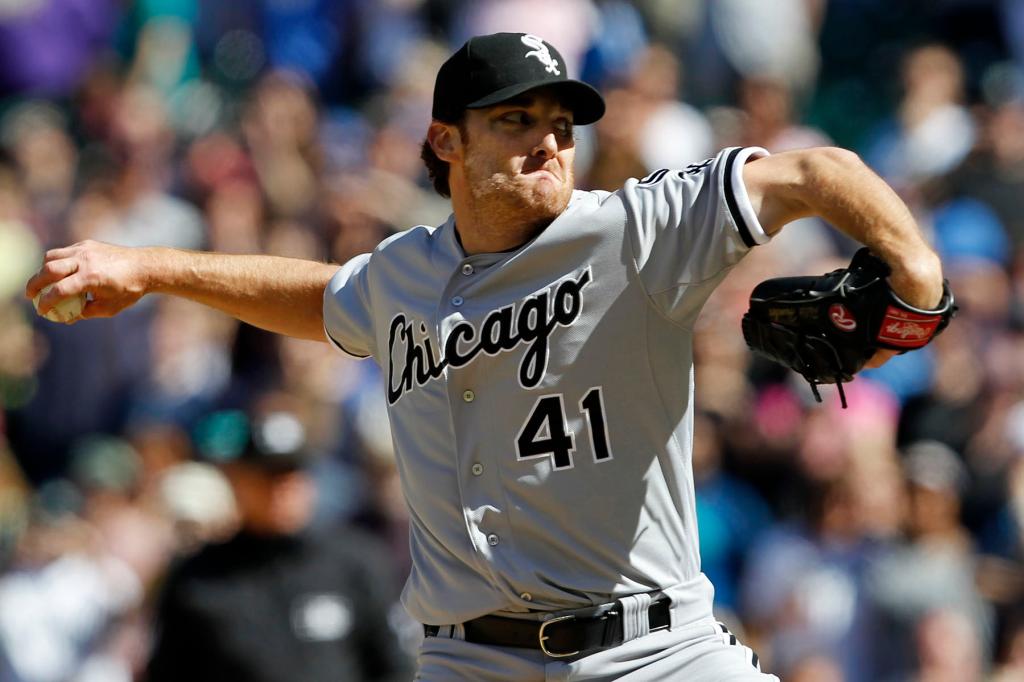 Chicago White Sox starting pitcher Phil Humber throws to the final batter while pitching a perfect baseball game against the Seattle Mariners, Saturday, April 21, 2012, in Seattle. The White Sox won 4-0.