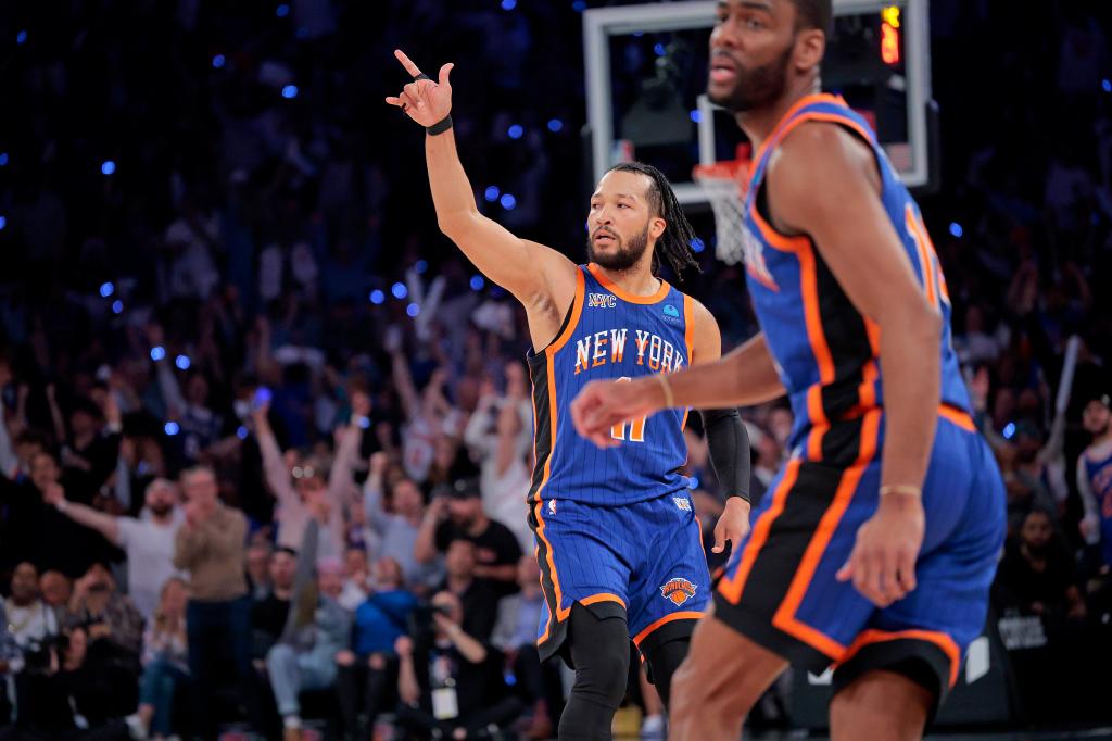 Knicks guard Jalen Brunson #11 reacts after he hits a three point shot