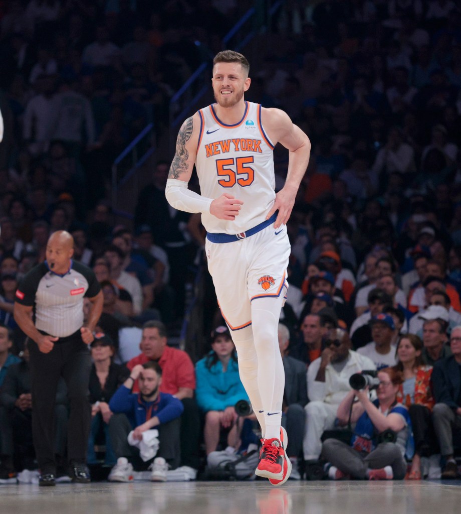 Knicks center Isaiah Hartenstein #55 is all smiles as he runs down court after scoring during the first quarter against the Pacers in Game 7 of the second round of the playoffs on May 19, 2024.
