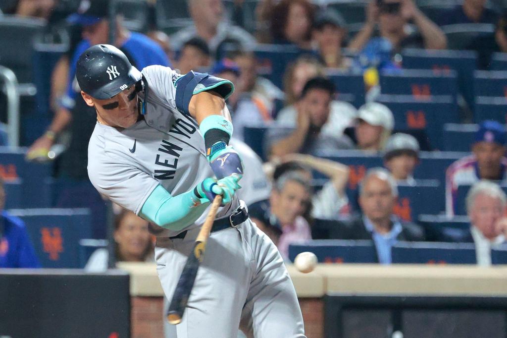 New York Yankees outfielder Aaron Judge #99 hits a two-run home run in the 6th inning.