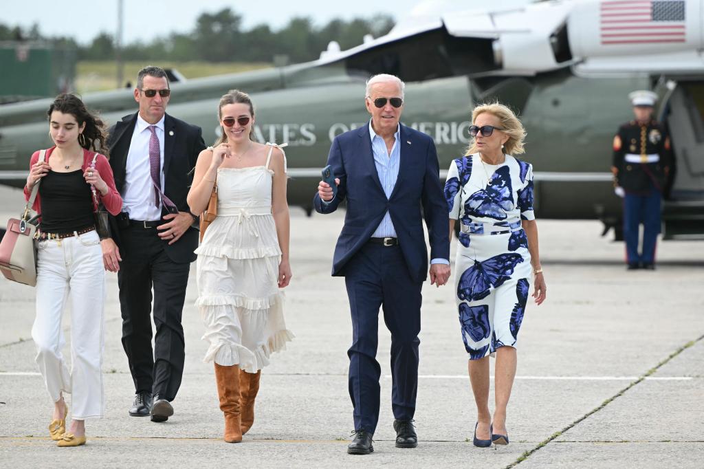 President Joe Biden and First Lady Jill Biden, along with granddaughters Natalie (L) and Finnegan (2nd L), walk from Marine One to board Air Force One at Francis S. Gabreski Airport in Westhampton Beach, New York on June 29, 2024.