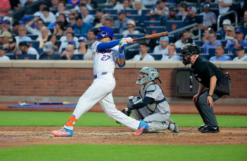 Mets third base Mark Vientos hits a home run  against the Yankees.