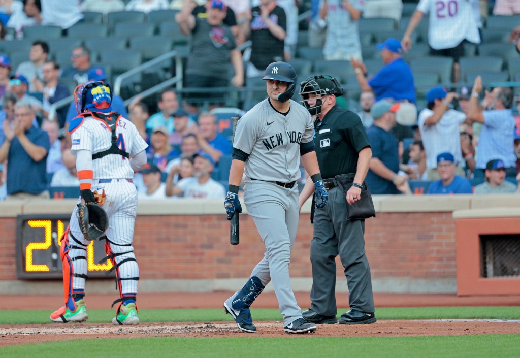 Yankees J.D. Davis reacts after he strikes out looking with the bases loaded ending the first inning.