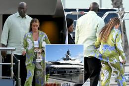 Michael Jordan holds hands with wife after departing his $115 million yacht in Barcelona 