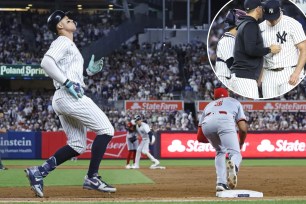 Aaron Judge grounds into a rally-killing, inning-ending double play in the seventh inning in the Yankees' 3-2 loss to the Reds. Aaron Boone talks with Carlos Rodon (inset) after taking him out of the game in the sixth inning.