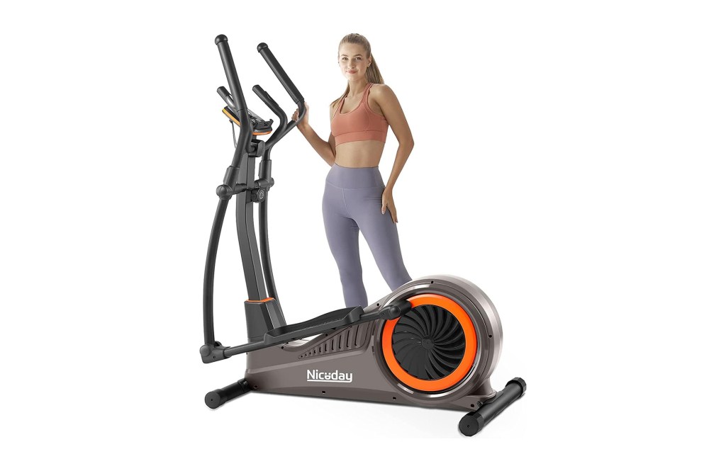 A woman standing next to an exercise machine