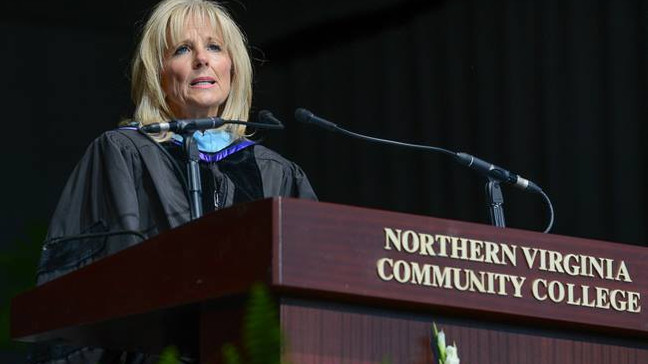 Jill Biden standing at a podium with microphones at Northern Virginia Community College, Alexandria campus