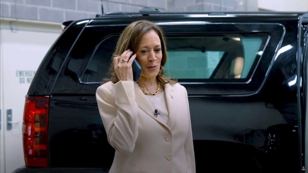 Kamala Harris talking on a cell phone after receiving endorsement call from the Obamas for her Presidential 2024 campaign