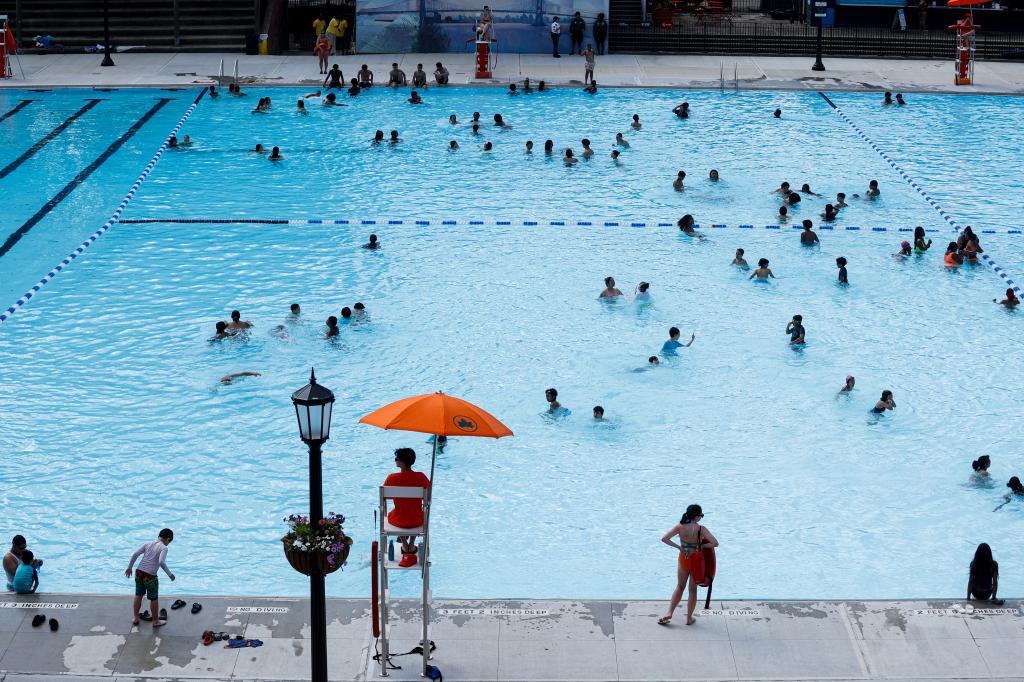 NEW YORK, UNITED STATES - JUNE 27: People spend their time in Astoria Pool, which is the city's largest pool, after it is reopened following the 18.9 million dollars renovation as New York City's outdoor pool season officially kicks off in New York, United States on June 27, 2024. (Photo by Lokman Vural Elibol/Anadolu via Getty Images)