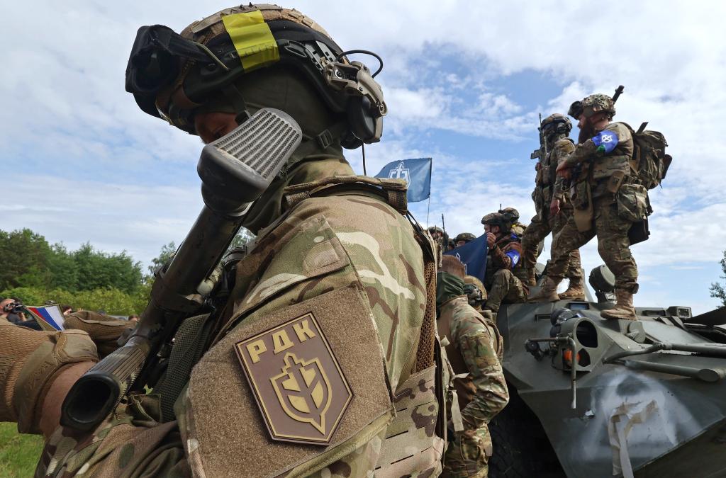 Representatives of the Russian Volunteer Corps (RDK) are pictured during a briefing near the border in northern Ukraine.