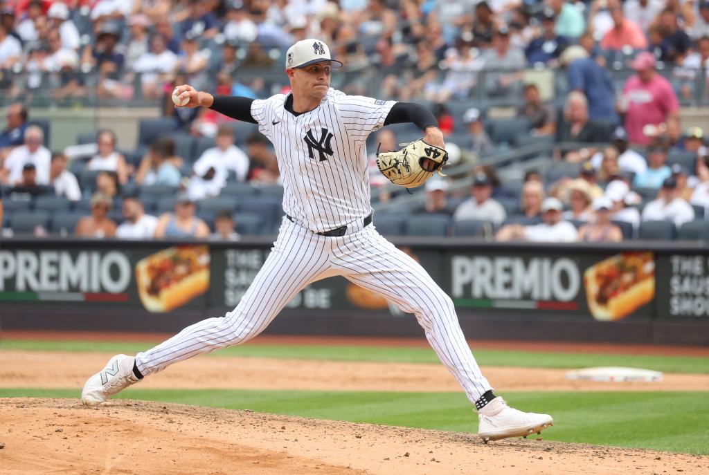 New York Yankees pitcher Jake Cousins in action during the seventh inning against the Cincinnati Reds at Yankee Stadium