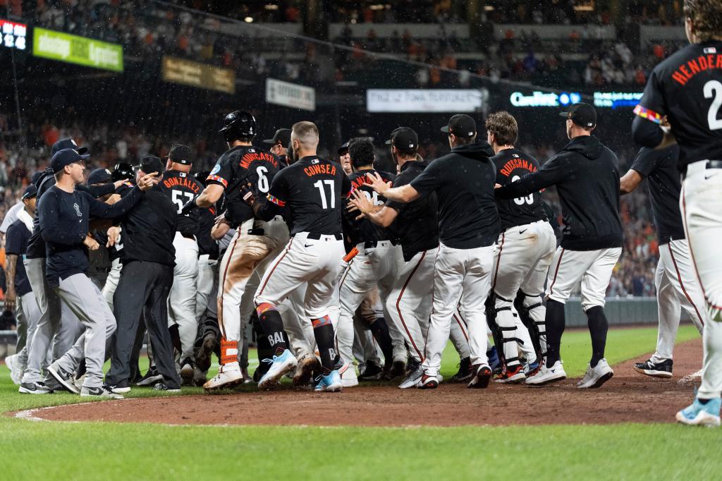 Players clear the benches after Baltimore Orioles' Heston Kjerstad was hit by a pitch from New York Yankees relief pitcher Clay Holmes during the ninth inning of a baseball game, Friday, July 12, 2024.