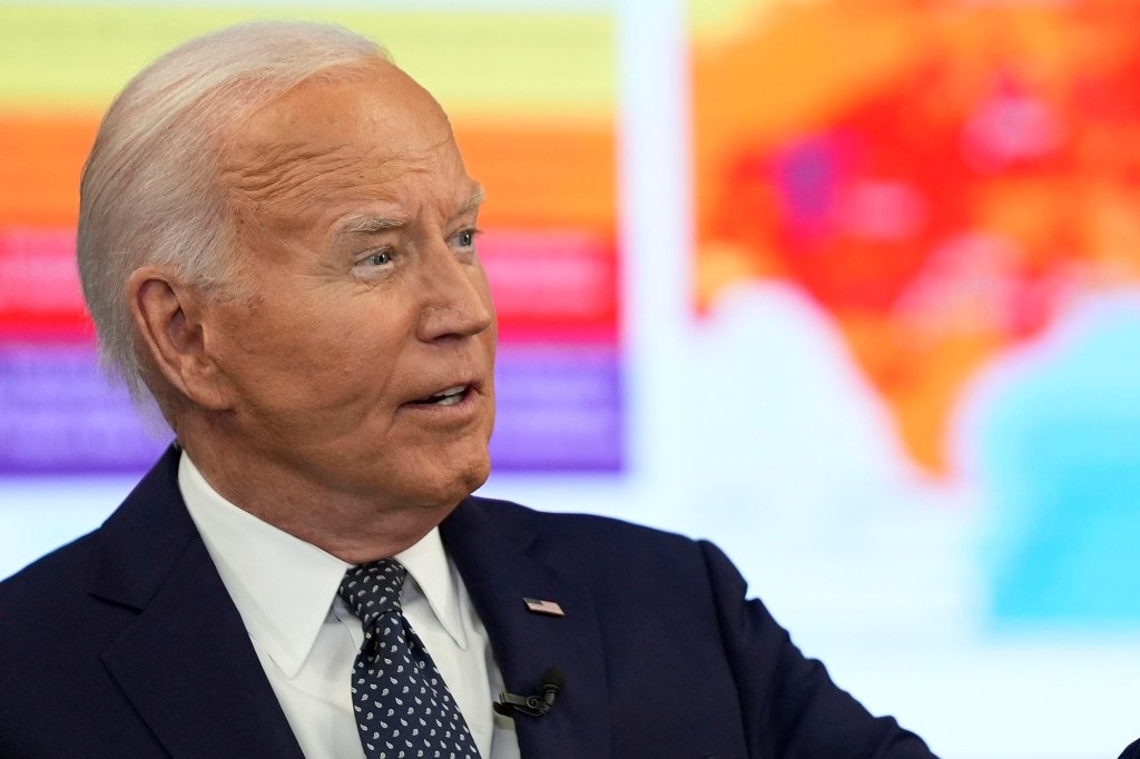 President Joe Biden speaking at the D.C. Emergency Operations Center in a suit and tie