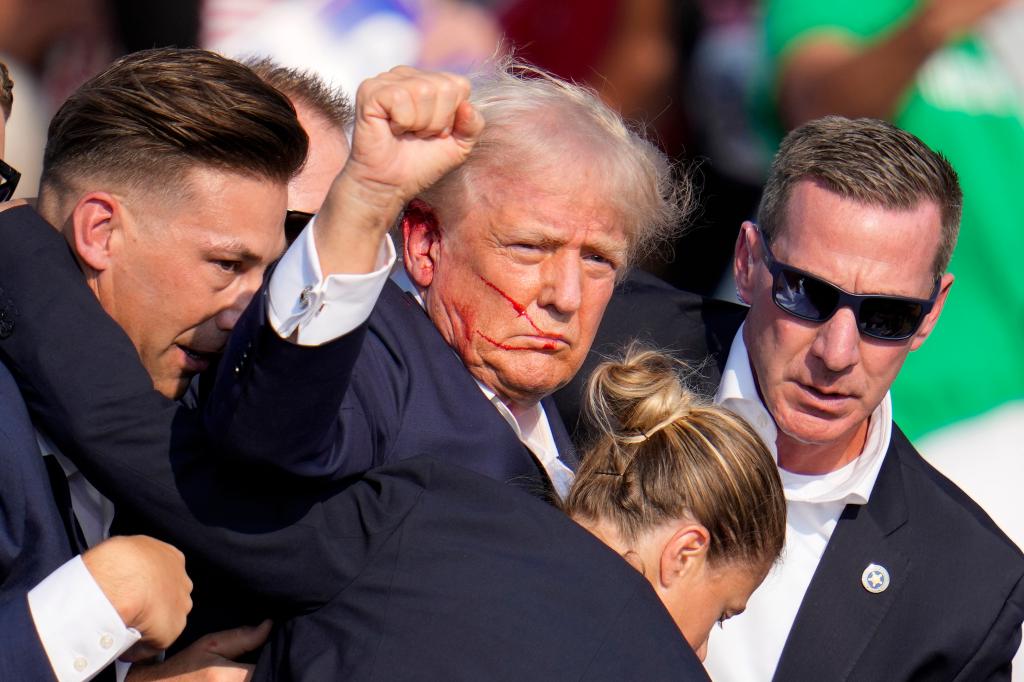 Former President Donald Trump raises his fist after an attempt on his life during a rally in Pennsylvania.