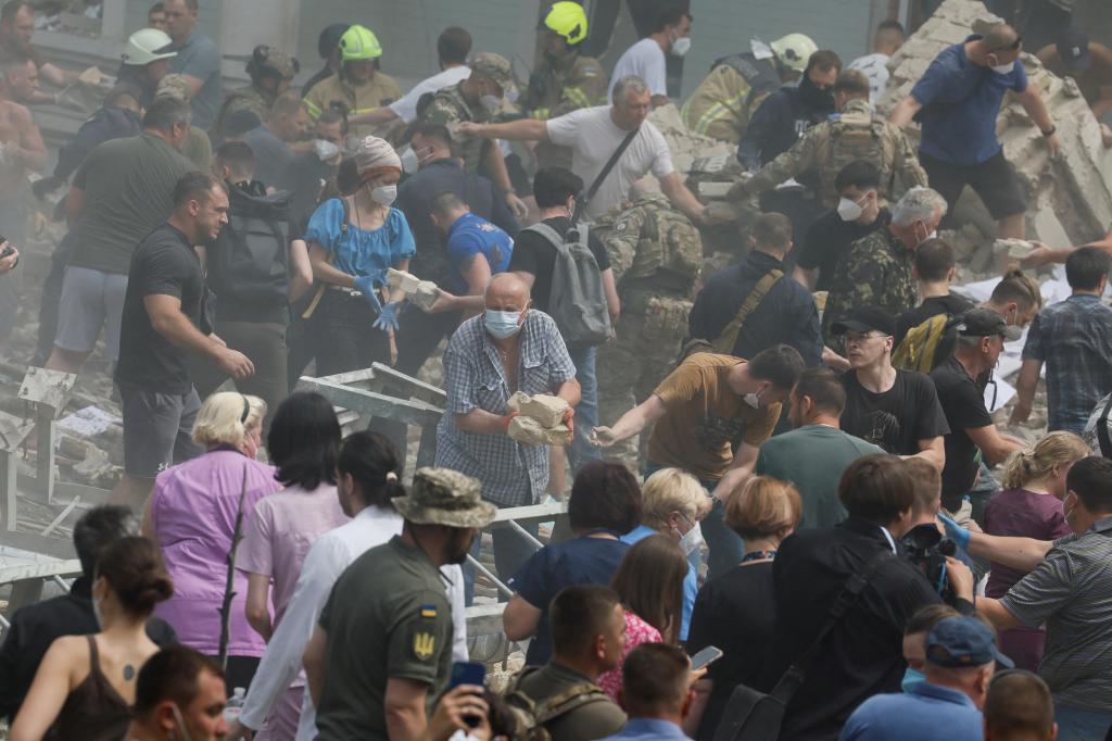 Rescuers work at Ohmatdyt Children's Hospital that was damaged during Russian missile strike