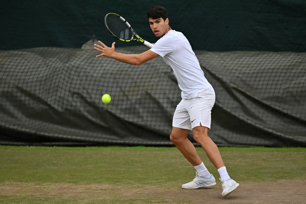 Spain's Carlos Alcaraz takes part in a training session on the eve of his men's final tennis match, at the Aorangi Practice Courts, on the thirteenth day of the 2024 Wimbledon Championships at The All England Lawn Tennis and Croquet Club in Wimbledon, southwest London, on July 13, 2024.