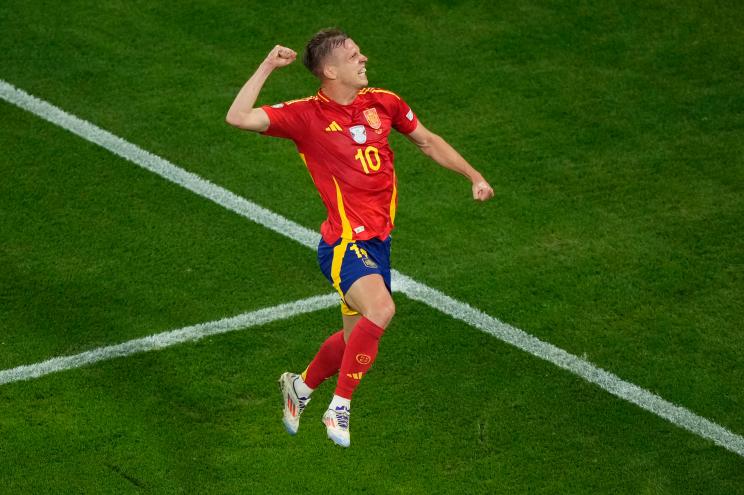 Spain's Dani Olmo celebrates scoring his side's 2nd goal during a semifinal match between Spain and France at the Euro 2024 soccer tournament in Munich, Germany, Tuesday, July 9, 2024.