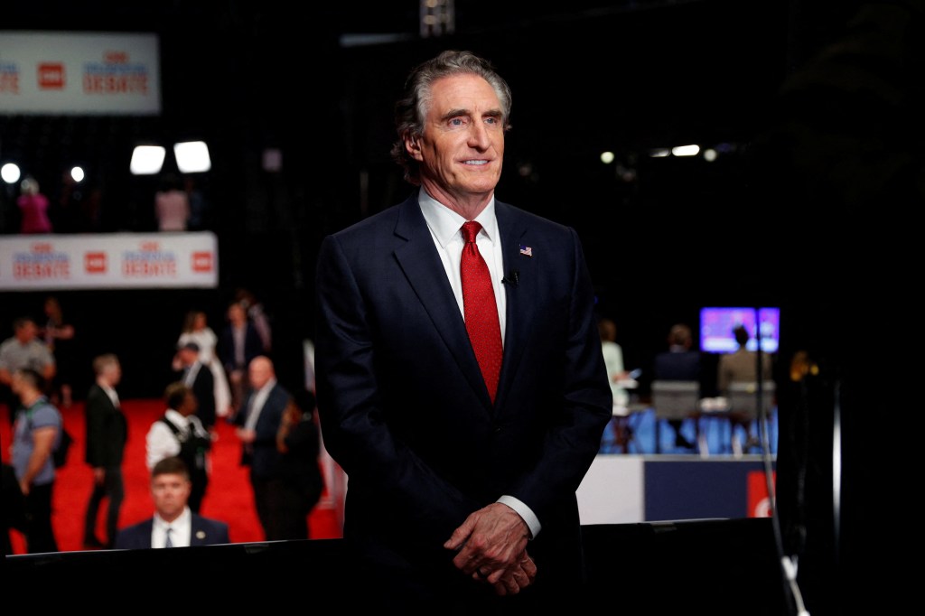 North Dakota Gov. Doug Burgum speaks to the press before the first presidential debate in Atlanta, Georgia on July 27, 2024.