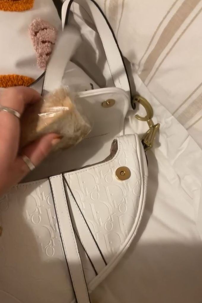 Burton putting her special bread in her bag.