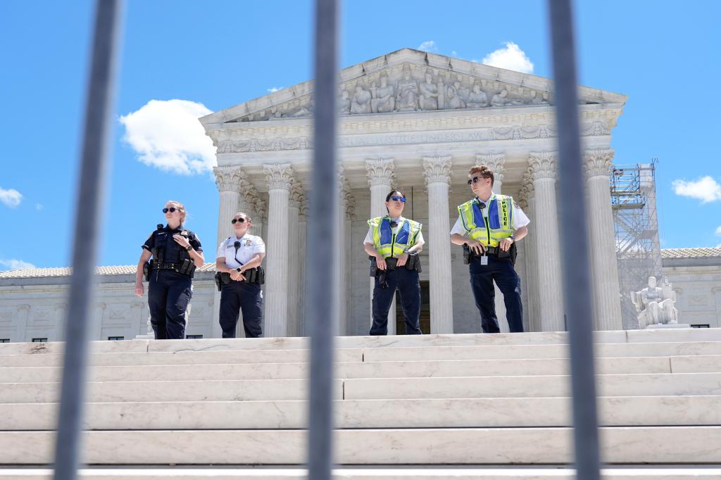 Supreme Court Police officers standing on the court steps in Washington on July 1, 2024