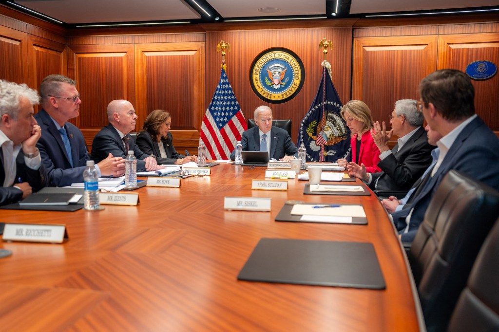 Biden and Vice President Kamala Harris getting briefed on the assassination attempt from the White House Situation Room with other cabinet officials.