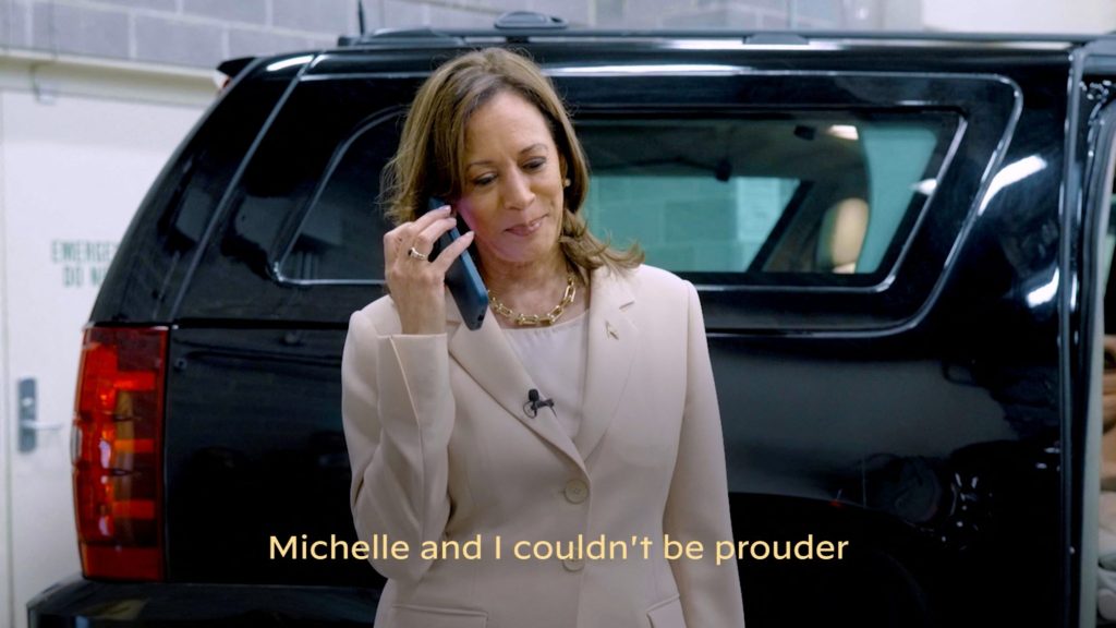 U.S. Vice President Kamala Harris speaking on a cell phone, in conversation with former President Barack Obama and former first lady Michelle Obama, following their endorsement for her presidential candidacy.