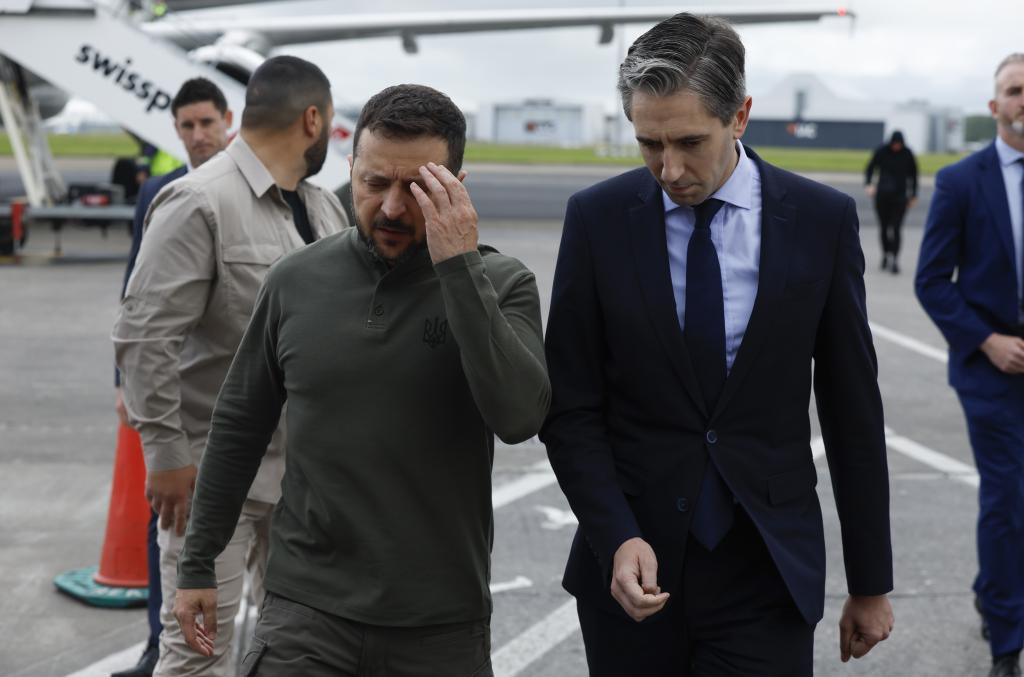 Taoiseach Simon Harris walks with Ukrainian President Volodymyr Zelensky ahead of their bilateral July 13 meeting at Shannon Airport in Ireland. 