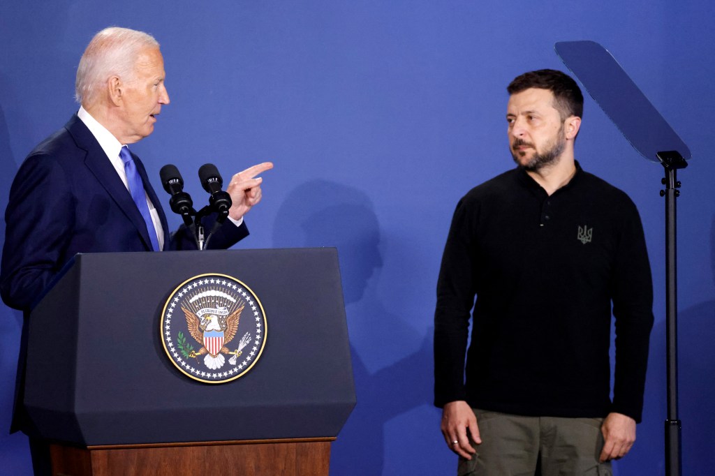 President Joe Biden speaks alongside Ukraine's President Volodymyr Zelensky during the Ukraine Compact initiative on the sidelines of the NATO Summit.