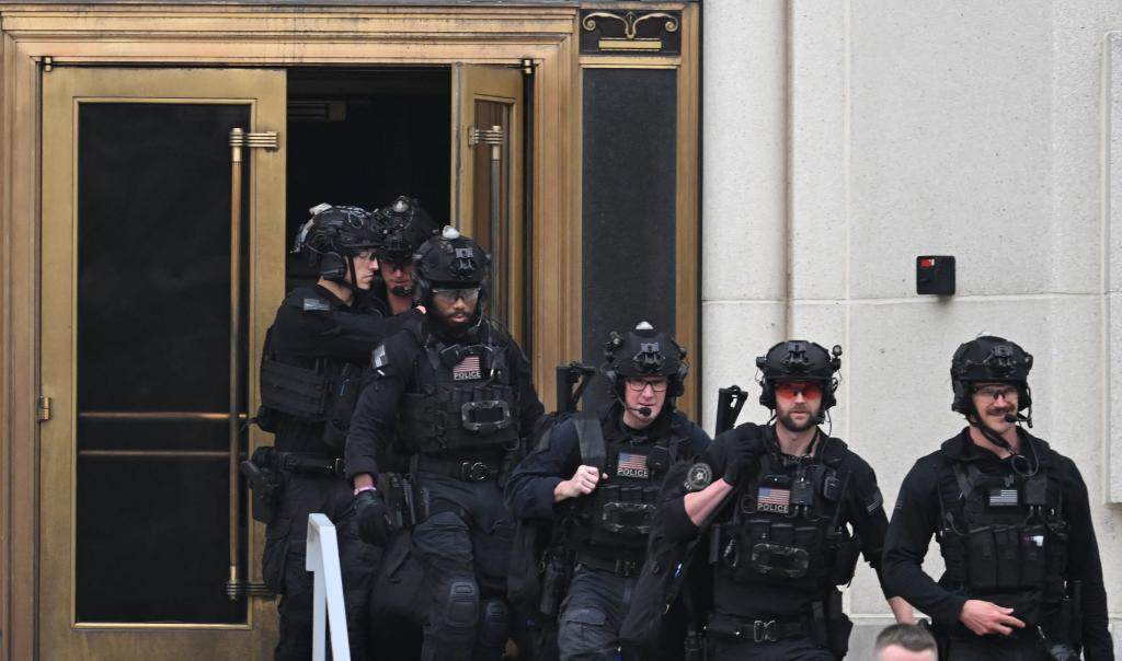 US Secret Service officers in black uniforms exiting Walter Reed Army Medical Center in Bethesda, Maryland, while President Joe Biden undergoes his annual physical in 2024