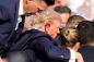 Video shows moment Trump was shot on side of the head in apparent assassination attempt
