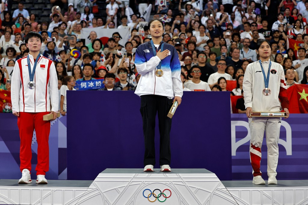 Gold medallist An Se-young from South Korea, silver medallist He Bing Jiao from China, and bronze medallist Gregoria Mariska Tunjung from Indonesia standing on the podium during the women's singles badminton medal ceremony at the Paris 2024 Olympic Games