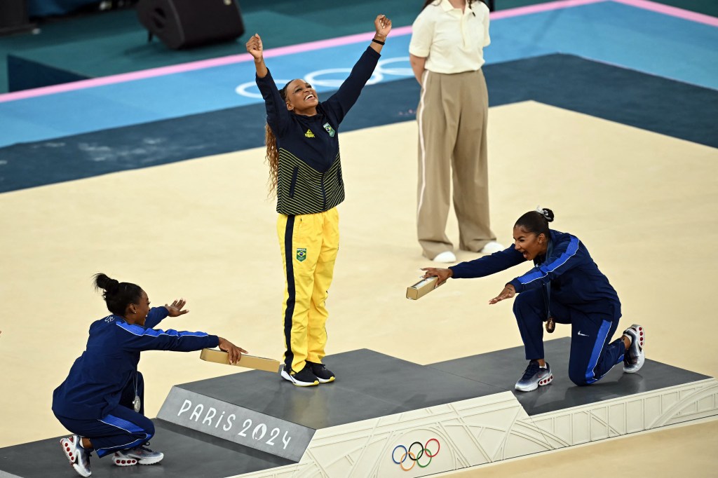 Rebeca Andrade won gold while Simone Biles and Jordan Chiles showed her respect. 