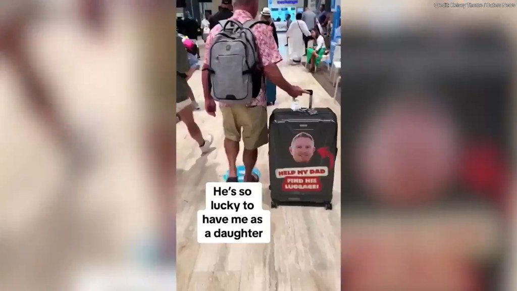 The prank showed the dad's face stickered onto his luggage.