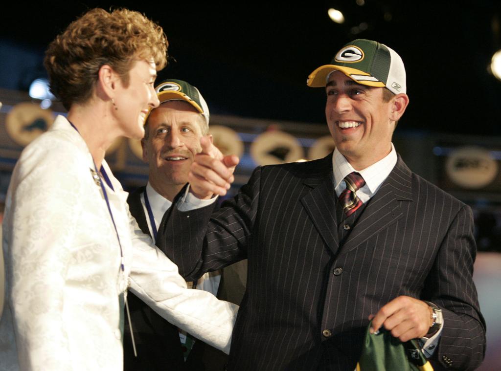 Aaron Rodgers, right, gathers with family members incouding his mom Darla Rodgers, left, after being selected by the Green Bay Packers as the 24th overall pick in the NFL draft Saturday, April 23, 2005