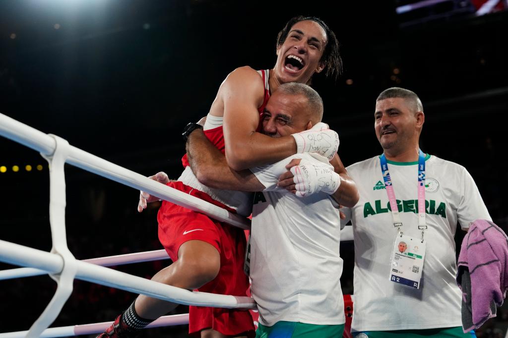 Algerian boxer Imane Khelif celebrates her gold medal victory over China's Yang Liu in the women's 66 kg final at the 2024 Paris Olympics