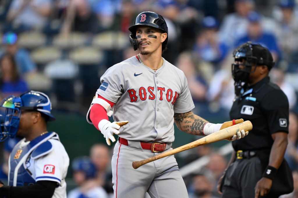 Red Sox's Jarren Duran walks back to the dugout after striking out during the first inning of a baseball game against the Kansas City Royals.